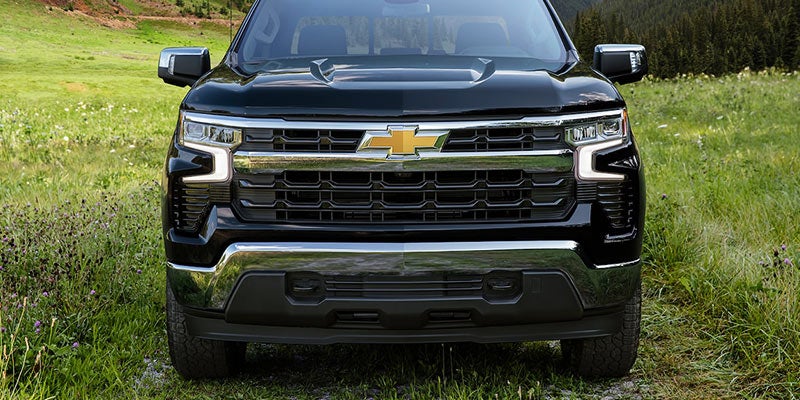 Silverado 1500 Parked on a Road having grass on it